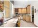 Bright kitchen with ample cabinetry and a large window at 4920 Sw 78Th Ave, Bushnell, FL 33513
