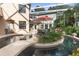 Relaxing pool area with seating and fountain at 4920 Sw 78Th Ave, Bushnell, FL 33513