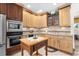 Well-equipped kitchen with ample cabinetry and stainless steel appliances at 4920 Sw 78Th Ave, Bushnell, FL 33513