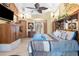 Spacious main bedroom with large bed and built-in shelving at 4920 Sw 78Th Ave, Bushnell, FL 33513