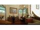 Elegant music room featuring a piano, organ and ample natural light at 4920 Sw 78Th Ave, Bushnell, FL 33513