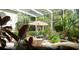 Relaxing enclosed patio with fountain, lush landscaping, and seating area at 4920 Sw 78Th Ave, Bushnell, FL 33513