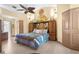 Main bedroom with king-size bed and ceiling fan at 4920 Sw 78Th Ave, Bushnell, FL 33513