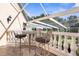 Private balcony with metal furniture and view of the backyard at 4920 Sw 78Th Ave, Bushnell, FL 33513