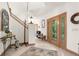 Elegant entryway with tiled floors, a staircase, and stained glass door at 4920 Sw 78Th Ave, Bushnell, FL 33513