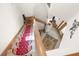 Elegant staircase with red carpet runner, leading to the upper level at 4920 Sw 78Th Ave, Bushnell, FL 33513
