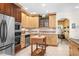 Bright kitchen with an island, stainless steel appliances, and lots of storage at 4920 Sw 78Th Ave, Bushnell, FL 33513