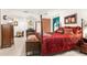 Main bedroom with a four-poster bed and ensuite bathroom at 4920 Sw 78Th Ave, Bushnell, FL 33513