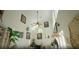 High-ceiling living room with a wall of windows and artwork at 4920 Sw 78Th Ave, Bushnell, FL 33513