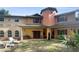 Two story home with covered porch and manicured lawn at 4920 Sw 78Th Ave, Bushnell, FL 33513