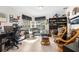 Spacious home office with two wicker armchairs at 4920 Sw 78Th Ave, Bushnell, FL 33513