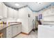 Laundry room with white cabinets and a washer and dryer at 4920 Sw 78Th Ave, Bushnell, FL 33513