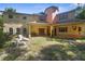 Two story home with covered porch and manicured lawn at 4920 Sw 78Th Ave, Bushnell, FL 33513