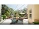 Serene courtyard with a tiered fountain and ample natural light at 4920 Sw 78Th Ave, Bushnell, FL 33513
