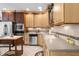Spacious kitchen featuring stainless steel appliances and wood cabinets at 4920 Sw 78Th Ave, Bushnell, FL 33513