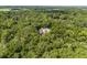 Aerial view of home surrounded by dense forest at 4920 Sw 78Th Ave, Bushnell, FL 33513