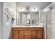 Double vanity bathroom with granite countertop and walk-in shower at 2541 Yellow Brick Rd, Saint Cloud, FL 34772
