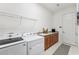 Laundry room with washer, dryer, and additional storage at 2541 Yellow Brick Rd, Saint Cloud, FL 34772