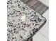 Close-up view of speckled granite kitchen countertop at 2541 Yellow Brick Rd, Saint Cloud, FL 34772