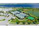 Aerial view of tennis courts and basketball court with lake view at 2541 Yellow Brick Rd, Saint Cloud, FL 34772
