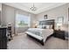 Spacious main bedroom with plush carpet and large window at 2541 Yellow Brick Rd, Saint Cloud, FL 34772