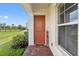 Welcoming front door entrance with brick walkway and home decor at 2541 Yellow Brick Rd, Saint Cloud, FL 34772