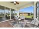Screened patio with seating area, overlooking the backyard at 2541 Yellow Brick Rd, Saint Cloud, FL 34772