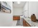 Bright laundry room with washer, dryer, and cabinets at 2541 Yellow Brick Rd, Saint Cloud, FL 34772
