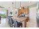 Modern kitchen with granite island and stainless steel appliances at 2541 Yellow Brick Rd, Saint Cloud, FL 34772