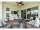 Covered patio with wicker furniture and a view of the backyard at 2541 Yellow Brick Rd, Saint Cloud, FL 34772