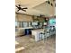 Fully equipped outdoor kitchen with seating area at 2541 Yellow Brick Rd, Saint Cloud, FL 34772