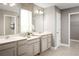 Elegant bathroom with double vanity and walk-in closet at 5706 Freshwater Canyon Dr, St Cloud, FL 34771