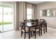Bright dining room featuring a table with chairs and access to backyard at 5706 Freshwater Canyon Dr, Saint Cloud, FL 34771