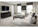 Cozy Gathering room boasts a sectional sofa and large TV at 5706 Freshwater Canyon Dr, St Cloud, FL 34771