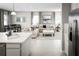 Open floorplan kitchen with island, view of living room and stainless steel appliances at 5706 Freshwater Canyon Dr, St Cloud, FL 34771