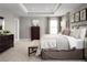 Spacious main bedroom with a king-size bed and dresser at 5706 Freshwater Canyon Dr, St Cloud, FL 34771