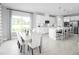 Modern kitchen with white cabinets, stainless steel appliances, and a large island at 360 Crossings Ave, St Cloud, FL 34771