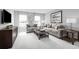 Spacious bonus room with couch and large windows at 360 Crossings Ave, St Cloud, FL 34771