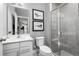 Modern bathroom with a walk-in shower and white vanity at 360 Crossings Ave, St Cloud, FL 34771