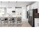 Modern kitchen with white cabinets, stainless steel appliances, and an island at 360 Crossings Ave, St Cloud, FL 34771