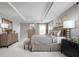 Large main bedroom with king-size bed and plenty of natural light at 360 Crossings Ave, St Cloud, FL 34771