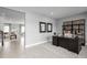 Home office with a large desk, built-in shelving, and natural light at 360 Crossings Ave, St Cloud, FL 34771