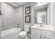 Clean bathroom with a shower/tub combo, toilet and white vanity at 360 Crossings Ave, St Cloud, FL 34771