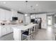 Modern kitchen with white cabinets, stainless steel appliances, and an island at 360 Crossings Ave, St Cloud, FL 34771