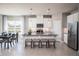 Spacious kitchen with white cabinets, granite countertops, and island seating at 5769 Anders Way, St Cloud, FL 34771