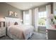 Spacious bedroom with a plush bed and soft color palette at 5769 Anders Way, St Cloud, FL 34771
