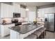 Modern kitchen with stainless steel appliances and large kitchen island at 5769 Anders Way, St Cloud, FL 34771