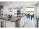 Open concept kitchen features a large island and stainless steel appliances at 5769 Anders Way, St Cloud, FL 34771