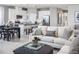 Open concept living room with kitchen and dining area view at 5769 Anders Way, St Cloud, FL 34771