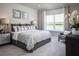 Comfortable main bedroom with water views and plenty of closet space at 5769 Anders Way, St Cloud, FL 34771